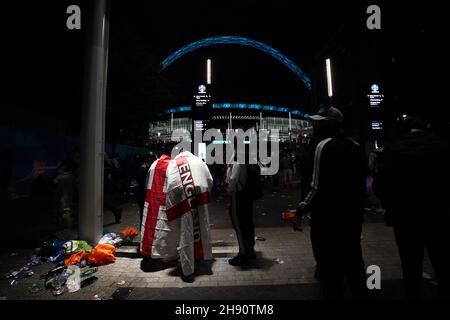 File photo dated 11-07-2021 of England fans outside the ground during the UEFA Euro 2020 Final at Wembley Stadium, London. An England win in the Euro 2020 final could have led to 6,000 ticketless individuals storming Wembley with 'horrific' consequences, an independent review has found. Picture date: Sunday July 11, 2021. Issue date: Friday December 3, 2021. Stock Photo