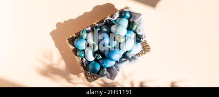 Homemade naturally dyed eggs in blue colors Stock Photo
