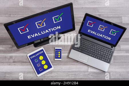 Evaluation concept shown on different information technology devices Stock Photo