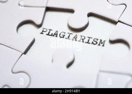 The word plagiarism written with a typewriter. Stock Photo