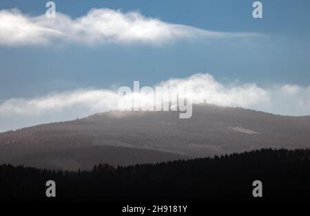 Oberwiesenthal, Germany. 23rd Nov, 2021. Clouds move over the Fichtelberg, with 1214 meters the highest mountain in Saxony. Credit: Jan Woitas/dpa-Zentralbild/ZB/dpa/Alamy Live News Stock Photo
