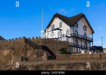 Thatched cottages on the seafront at Sidmouth, Devon UK in November Stock Photo