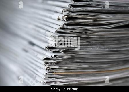 Dresden, Germany. 01st Dec, 2021. ILLUSTRATION - A stack of various daily newspapers lies on a table. Credit: Sebastian Kahnert/dpa-Zentralbild/ZB/dpa/Ģ����ý Live News Stock Photo