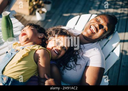 High angle view of daughters and mother in backyard Stock Photo