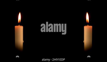 Two burning candles on a black background. Religious rituals Stock Photo