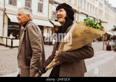 Senior couple exploring city during weekend Stock Photo