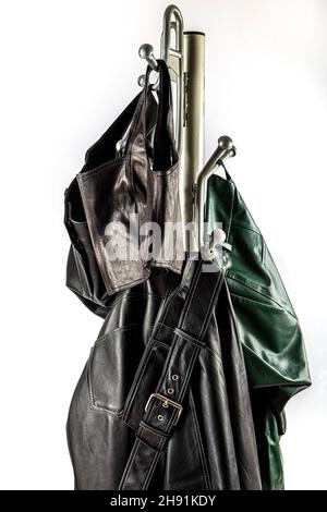 New collection of different color spring leather jackets. Leather jackets on hangers in the shop. Colorful background of modern spring, autumn outerwe Stock Photo