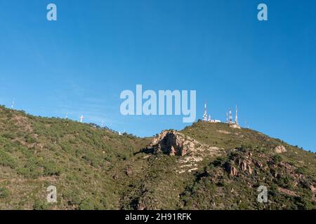 Mountain Range with Antennas on the Top Stock Photo