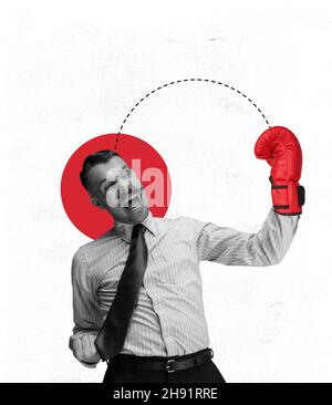 Contemporray art collage of businessman in boxing gloves hitting head isolated over white background Stock Photo