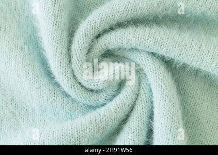 Swirl of light green alpaca fabric and mohair wool sweater texture Stock Photo