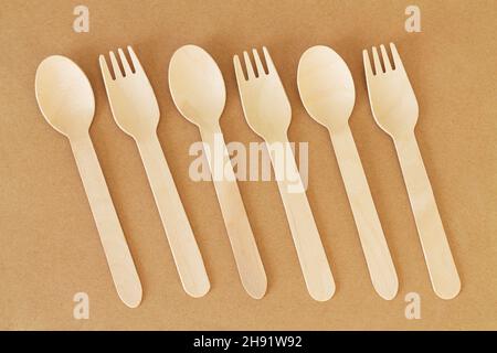 Disposable wooden cutlery (spoons and forks) top view Stock Photo