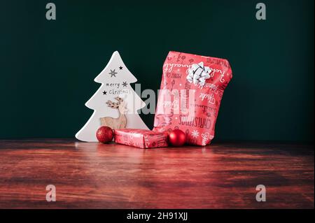 Atmospheric photo of a packed Christmas present with decoration. Stock Photo