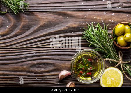 Flat lay food background made of oils condiments and spices on kitchen table. Cooking concept Stock Photo