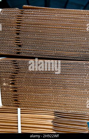 Corrugated packaging boxes folded and made bunch for packing material. Used selective focus. Stock Photo