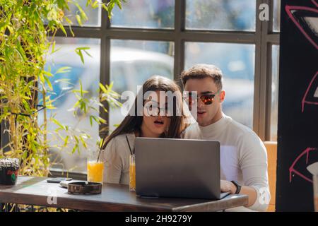 Co-workers spending time together on a break while working on a project on a lovely sunny day. Stock Photo