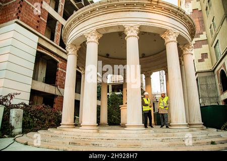 Two construction workers are standing and talking at the construction area Stock Photo