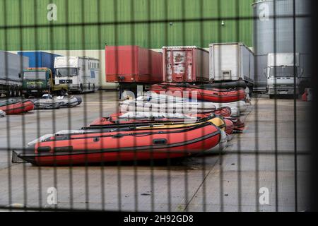 Dover, UK. 14th Nov, 2021. Migrant inflatable boats are seen at the industrial estate near the town of Dover.Large numbers of migrants are crossing the English Channel with the intention of claiming asylum in the UK. Migrants use large inflatable boats to sail from the Calais area of France to the UK and the border forces are legally obliged to rescue them once they reach British territorial waters, once they are rescued by the border force they are processed in the Dover docks and taken to temporary accommodation around the UK. (Credit Image: © Edward Crawford/SOPA Images via Stock Photo