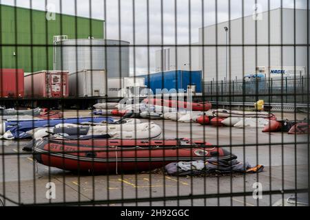 Dover, UK. 14th Nov, 2021. Migrant inflatable boats are seen at the industrial estate near the town of Dover.Large numbers of migrants are crossing the English Channel with the intention of claiming asylum in the UK. Migrants use large inflatable boats to sail from the Calais area of France to the UK and the border forces are legally obliged to rescue them once they reach British territorial waters, once they are rescued by the border force they are processed in the Dover docks and taken to temporary accommodation around the UK. (Credit Image: © Edward Crawford/SOPA Images via Stock Photo