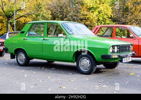 Bucharest, Romania, 24 October 2021: Old vivid green Romanian Dacia 1310 TX classic car produced in year 1987 parked in a street in the city center, i Stock Photo