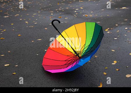 Upside down umbrella on the pavement. Stock Photo