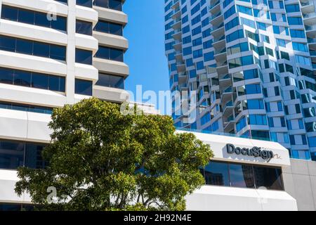 DocuSign sign and logo on facade of company headquarters building. DocuSign, Inc.allows organizations to manage electronic agreements. - San Francisco Stock Photo