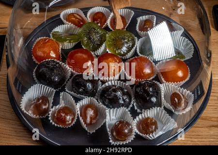 Close up of mixed dried and caramelized fruits on the shop. High quality photo Stock Photo