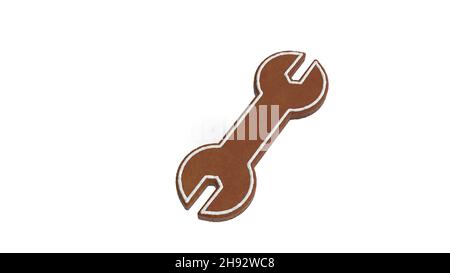 3d rendering of gingerbread cookie in shape of symbol of wrench isolated on white background with white icing Stock Photo