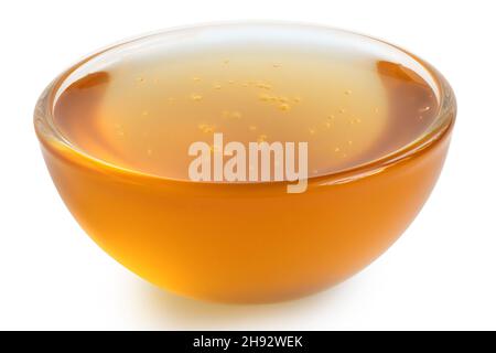 Chicory syrup in a glass dish isolated on white. Stock Photo