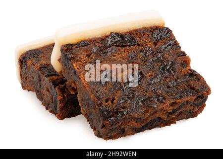 Two slices of iced fruit cake isolated on white. Stock Photo