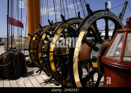 AJAXNETPHOTO. 4TH JUNE, 2015. PORTSMOUTH, ENGLAND. - HMS WARRIOR 1860 - FIRST AND LAST IRONCLAD WARSHIP OPEN TO THE PUBLIC. BRASS BOUND SHIP'S WHEELS INSCRIBED 'PRINCESS IS MUCH PLEASED'.PHOTO:JONATHAN EASTLAND/AJAX REF:D150406 5238 Stock Photo