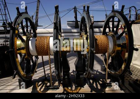 AJAXNETPHOTO. 4TH JUNE, 2015. PORTSMOUTH, ENGLAND. - HMS WARRIOR 1860 - FIRST AND LAST IRONCLAD WARSHIP OPEN TO THE PUBLIC. PROFILE OF BRASS BOUND SHIP'S WHEELS.PHOTO:JONATHAN EASTLAND/AJAX REF:D150406 5239 Stock Photo