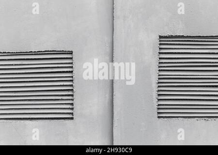 Industrial cooling ventilation grille, panel mounted in the wall of the transformer old box. Stock Photo