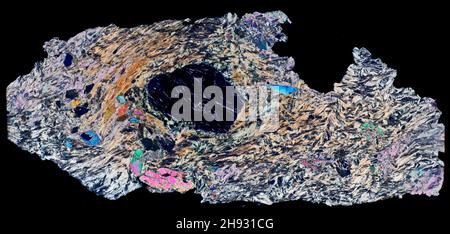 Chlorite schist,  mineral thin section viewed with polarized lighting. Larizo valley, Italian alps. Stock Photo