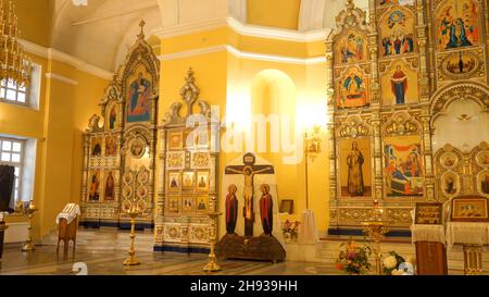 Beautiful Golden interior of Church with bright icons. Stock footage. Beautiful iconostasis in middle of Golden hall of Church. Luxury gold interior o