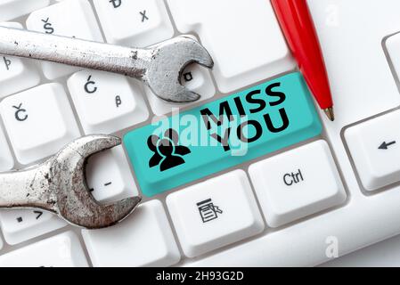 Writing displaying text Miss You. Business showcase Feeling sad because you are not here anymore loving message Writing Comments On A Social Media Stock Photo