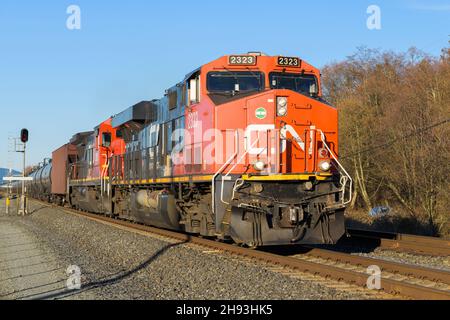 Stanwood, WA, USA - January 29, 2019; Two Canadian National locomotives lead a southbound oil train through Stanwood in Washington State, USA Stock Photo