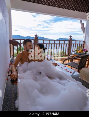 Spa, couple men and woman mid age enjoying the spa in Thailand. man and woman in spa bathtub Stock Photo
