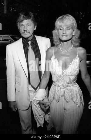 Charles Bronson and Jill Ireland  at the wedding reception for producer Al Ruddy and newspaper columnist Wanda McDaniel on June 21, 1981. Credit: Ralph Dominguez/MediaPunch Stock Photo