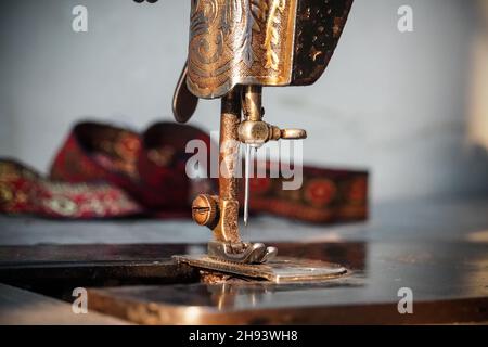 Illustration of a seamstress dressmaker tailor sewing with vintage machine  done in retro woodcut style Stock Vector Image & Art - Alamy