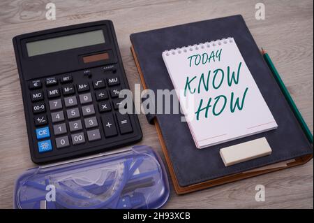 Text sign showing Know How. Word Written on The process to learn of doing things you will do for the first time Blank Notebook Page With A Calculator Stock Photo