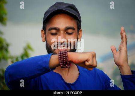 young man showing his hand and making wish Stock Photo