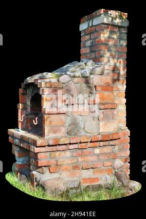 Old rustic stove made of red bricks. Isolated on black Stock Photo