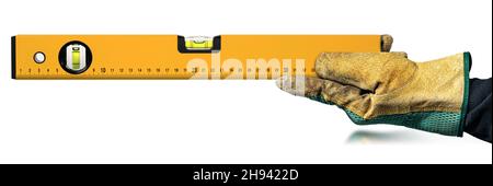 Manual Worker with protective work gloves, holding an orange construction spirit level, isolated on white background. Stock Photo