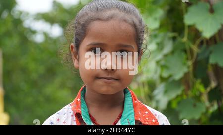 Portrait of little excited shocked crazy smiling girl in village Stock Photo