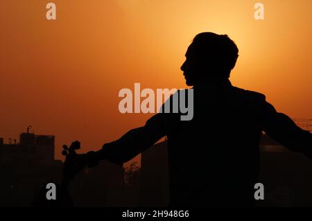 silhouette images of man musician Stock Photo