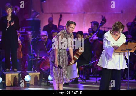 Gothenburg, Sweden. 03rd Dec, 2021. Actress Alicia Vikander, who was  awarded this year's honorary scholarship by the Sten A Olsson Foundation,  dances with her old dance teacher Sebastian Michanek at a gala