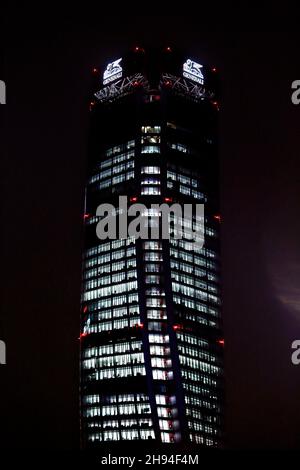 The tower skyscraper built in 2020 in Milan CityLife district area called Hadid Tower (Generali) seen from the MiCo Convention centre in a night view. Stock Photo