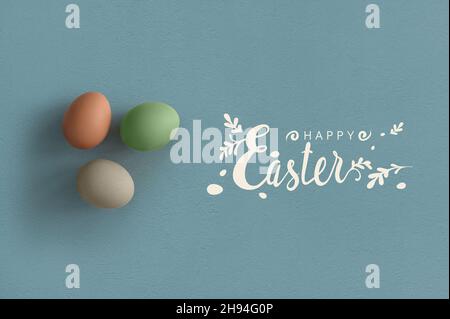 Colorful eggs top view with happy Easter lettering Stock Photo