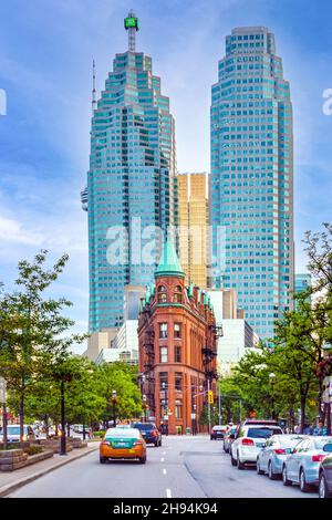 The Gooderham or Flatiron Building (red) in the Old Toronto district. The famous place is a tourist attraction. Nov. 22, 2021 Stock Photo