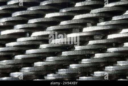 Stacks of shiny iron coins lying sideways on the whole frame Stock Photo